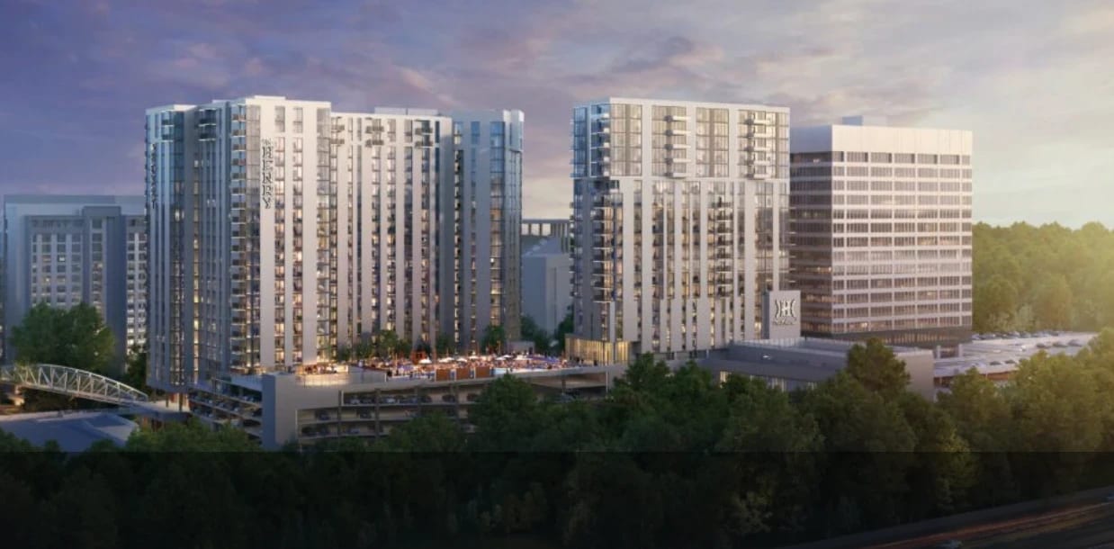 Wide architectural rendering of The Henry development showing both towers from a distance.